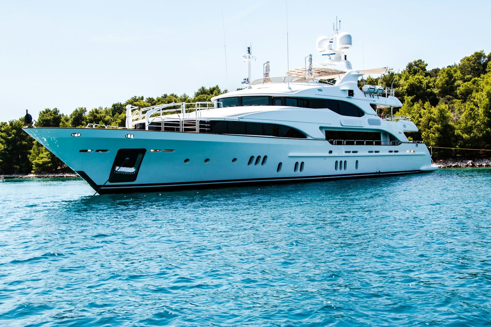 Editorial photograph of a yacht at dusk